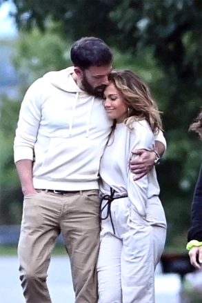 Jennifer Lopez and Ben Affleck hold hands as they walk with their kids to dinner in Paris.